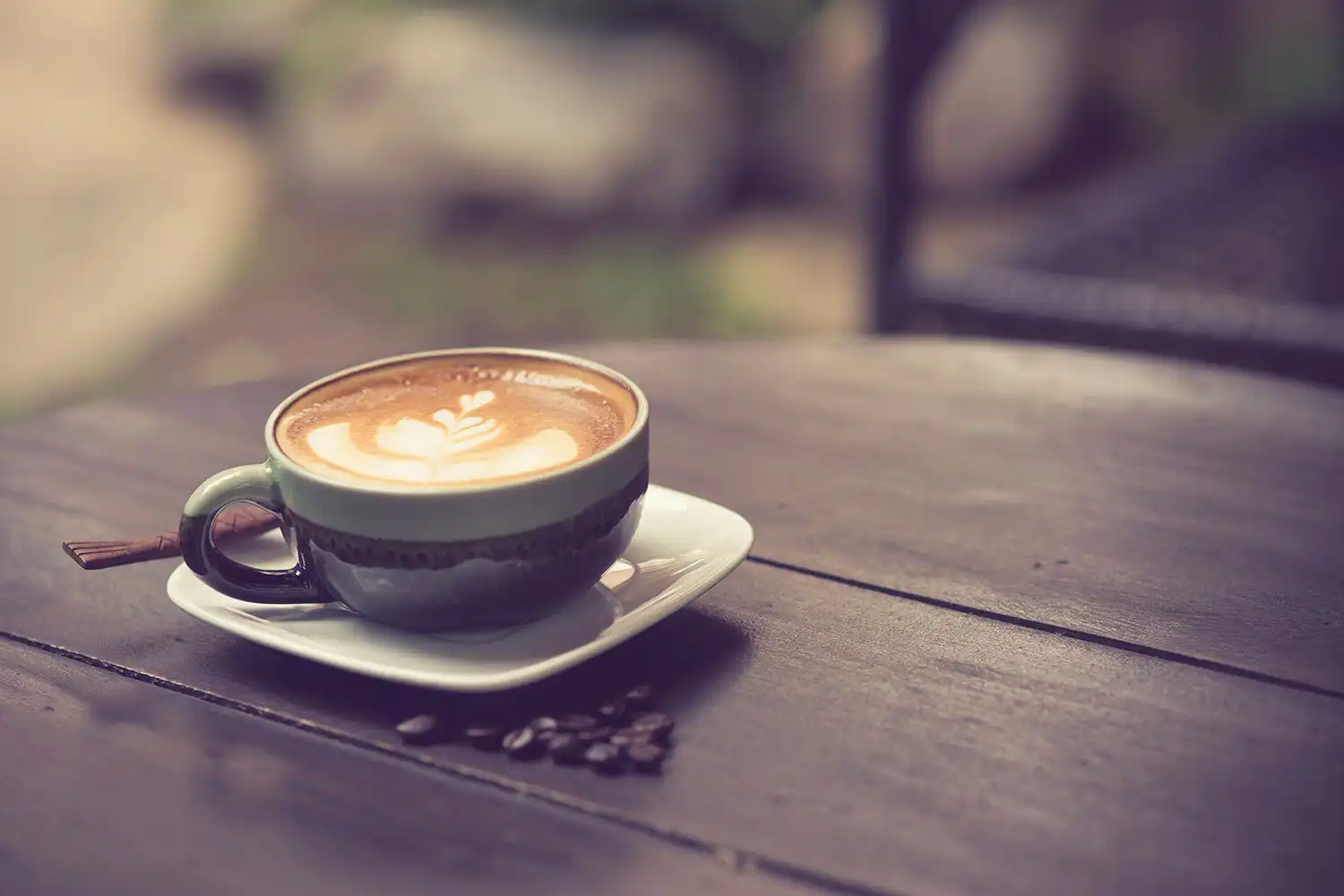 Cup of cappuccino on a wooden table