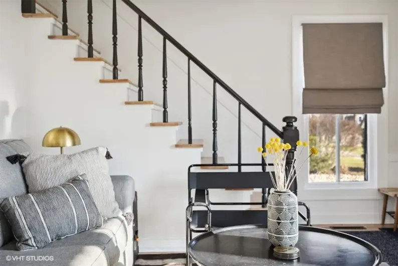 Staircase and sitting area of a Juniper home