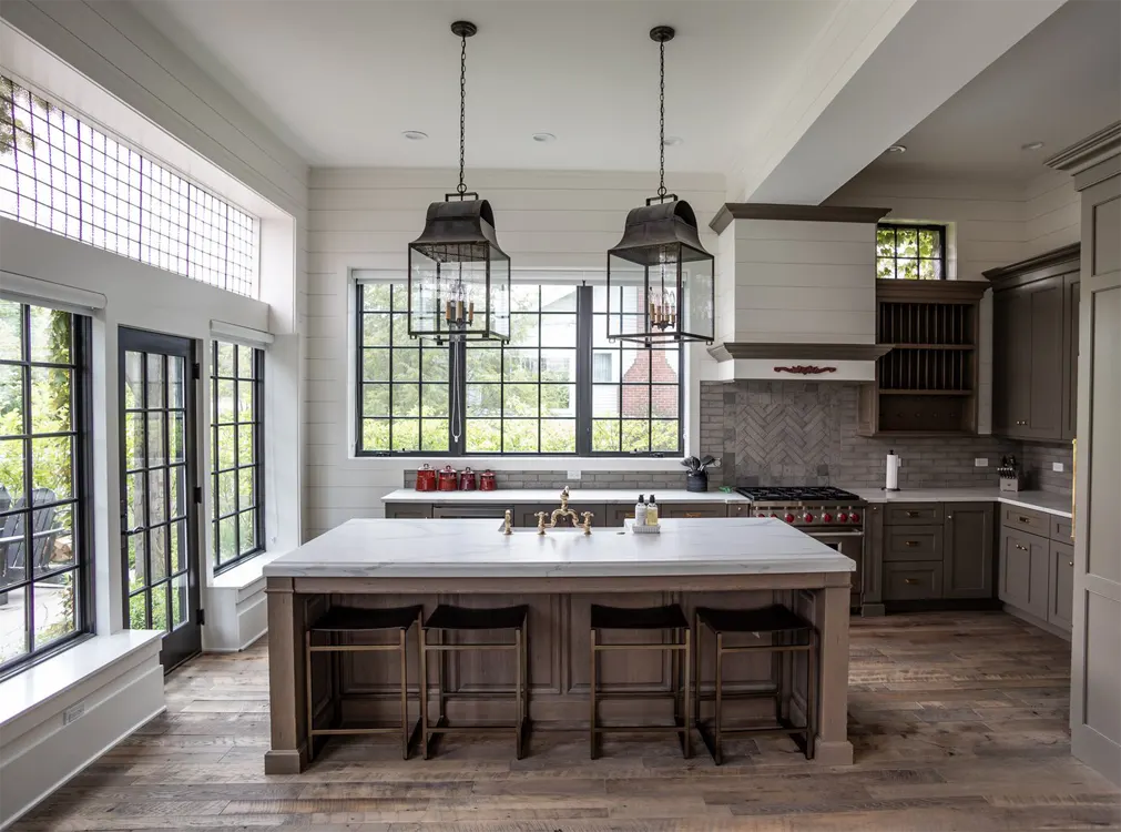 Designer kitchen with a marble island and pendant lights